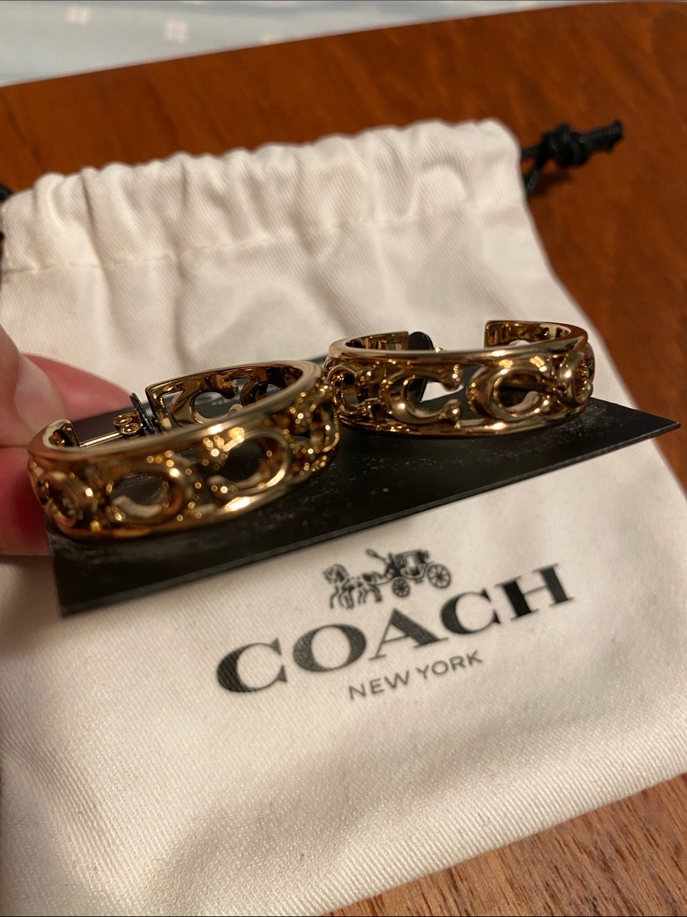 Coach Gold-Tone Hoop Earrings with Signature Cutouts - Picture 2 of 4